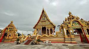  quiet street lined with trees and modern Thai or resort-style villas.